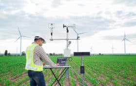 Engineer using tablet computer collect data with meteorological