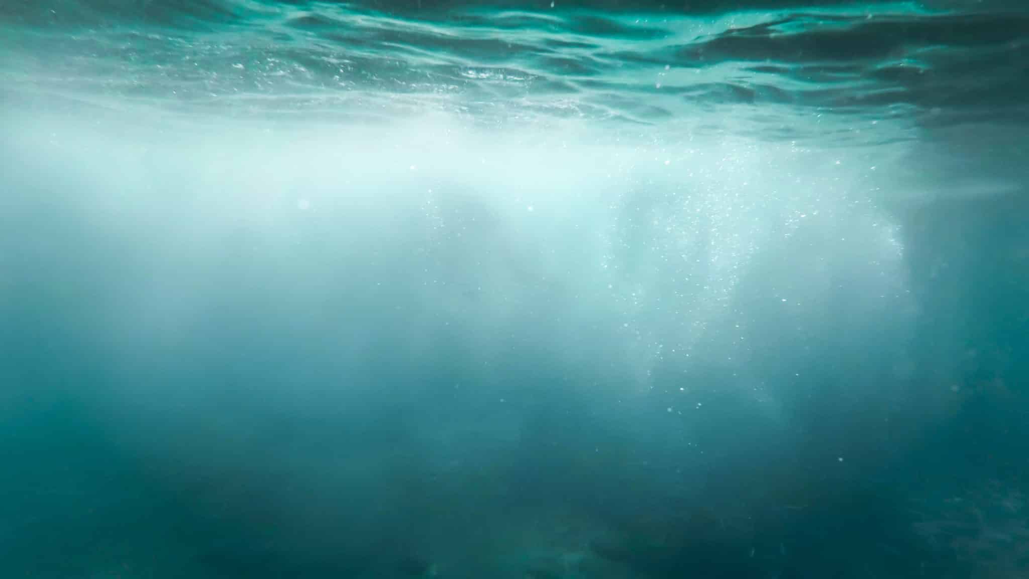 bubbles floating in clear turquoise ocean