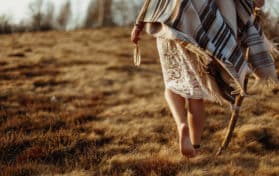 woman native indian american boho dress walking in windy