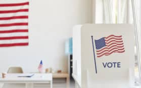 voting booths decorated with American flags