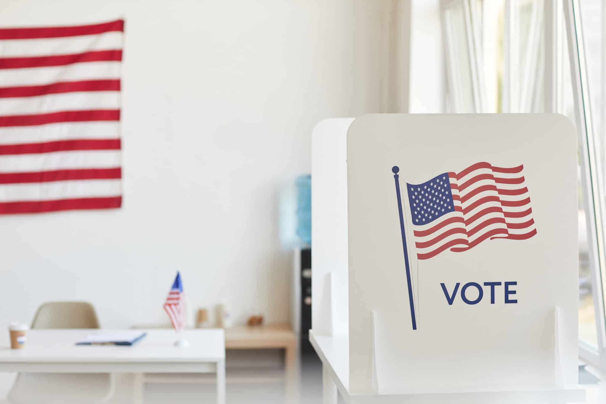 voting booths decorated with American flags