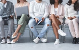 young people sitting in line for interviews