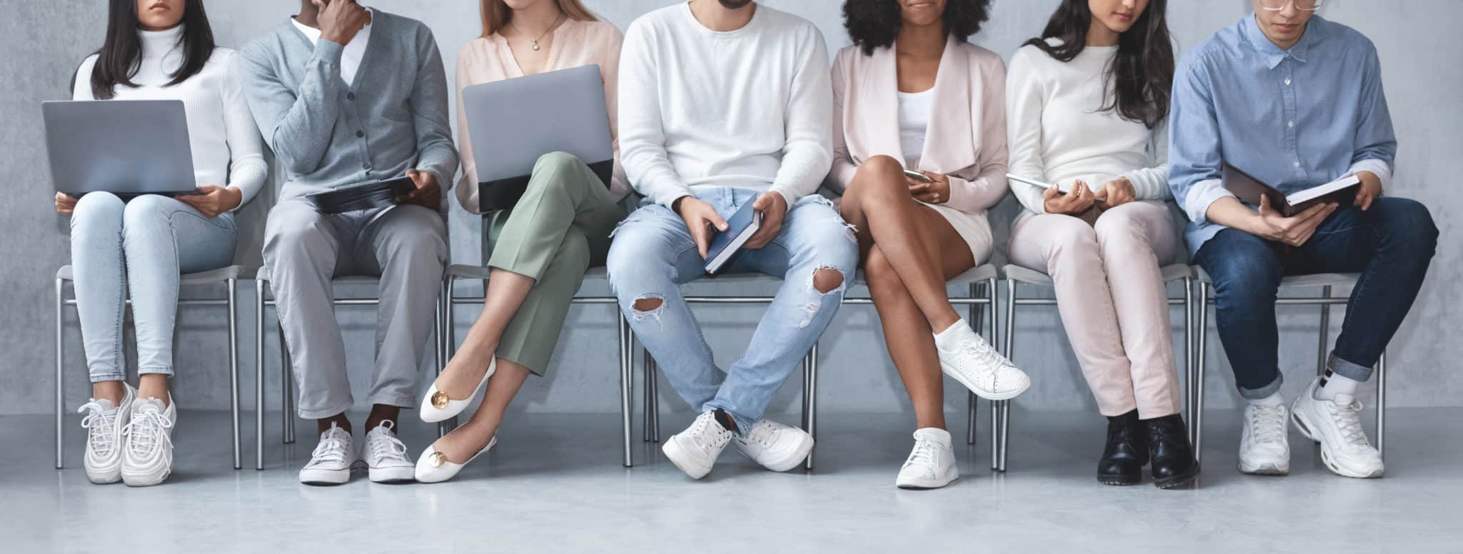 young people sitting in line for interviews