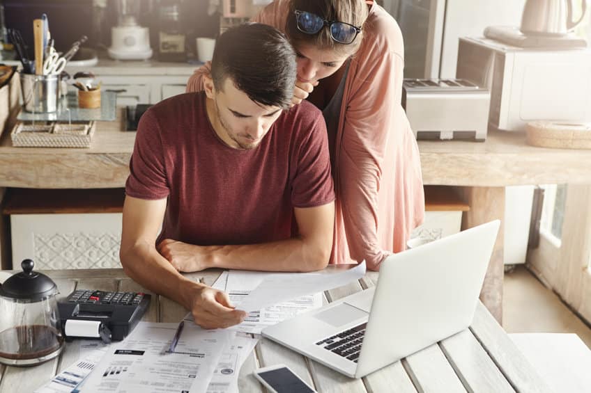 young couple filing taxes