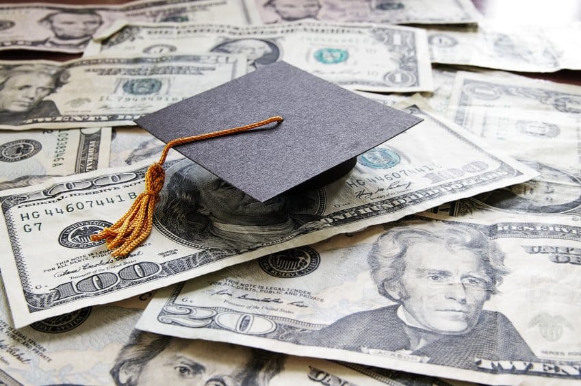 Graduation cap on a pile of money